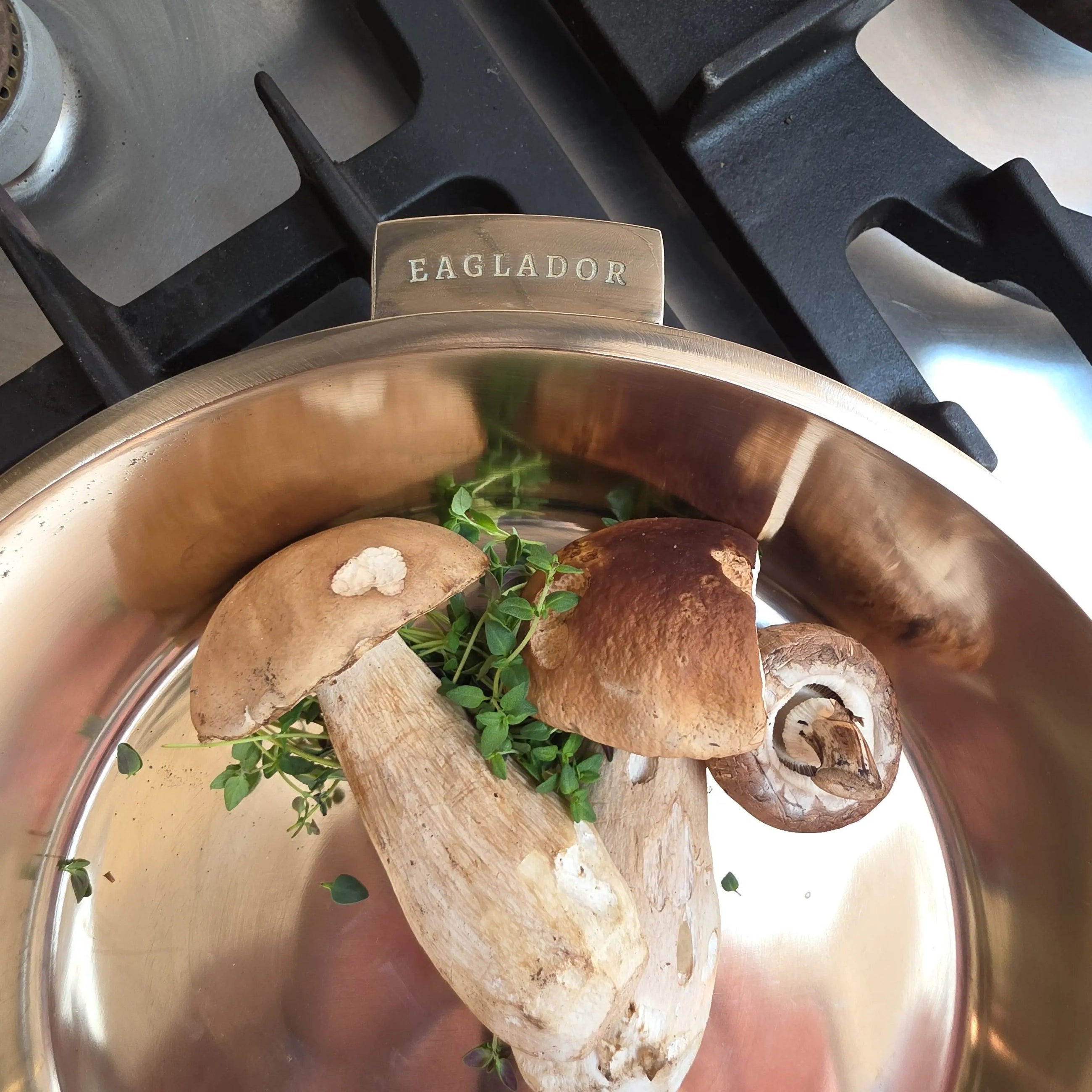 "Close up of Eaglador's uncoated Kansa Bronze frying pan with cep mushrooms - Kansa cookware UK".