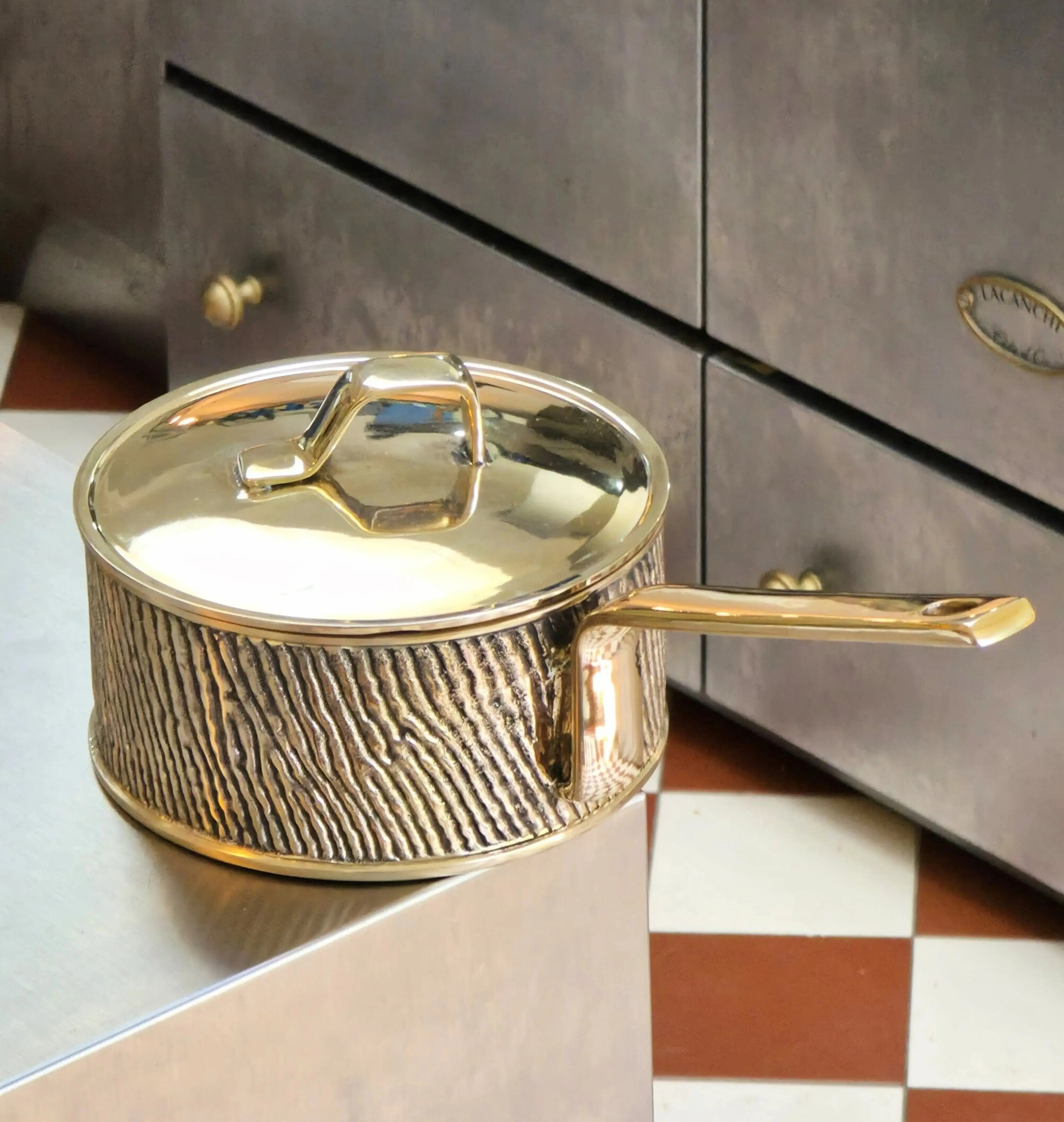 Close-up of luxury PFAS-free uncoated Kansa bronze saucepan with welded handle