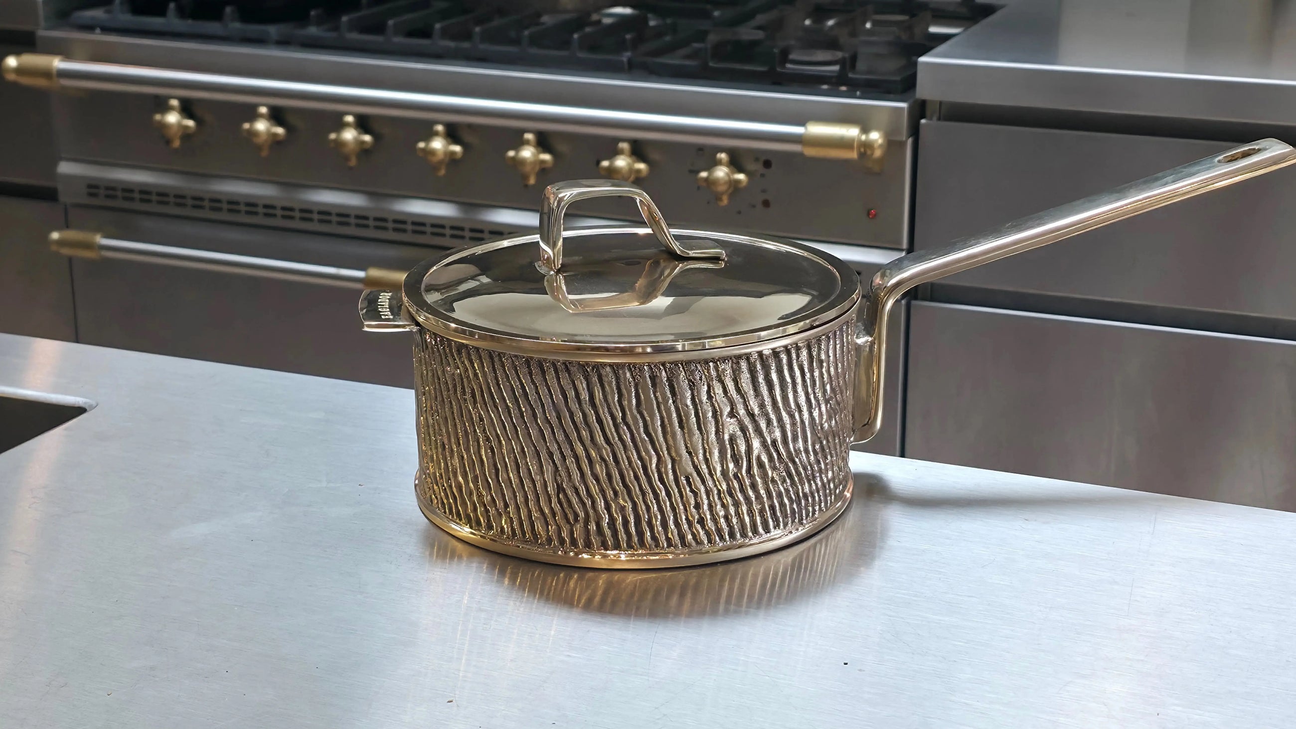 Luxury PFAS-free uncoated Kansa bronze saucepan on modern kitchen counter