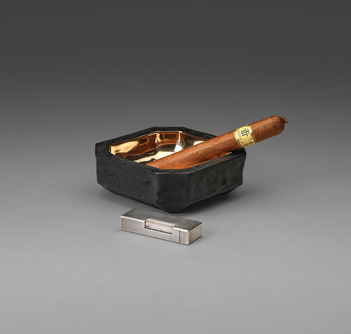 Bronze objet with cigar