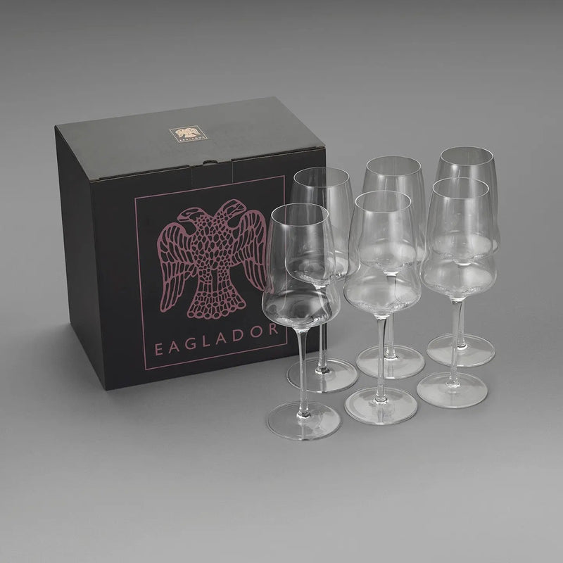 "A set of six wine glasses by Eaglador next to branded box - premium stemware UK".