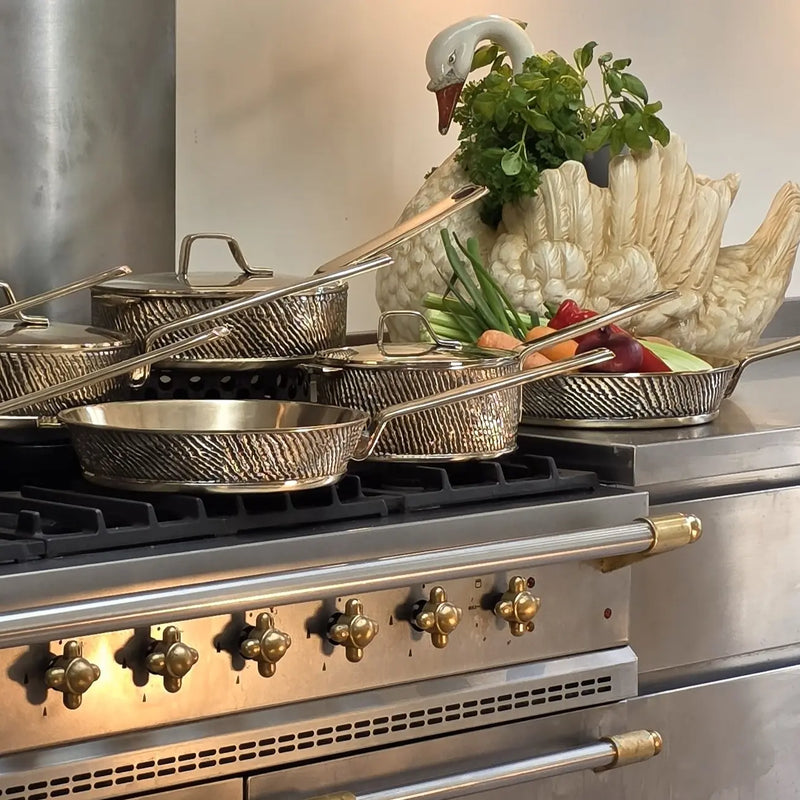 "Eaglador 3 Piece heavy gauge Kansa cooking Set seen on a stovetop - Luxury Cookware UK".