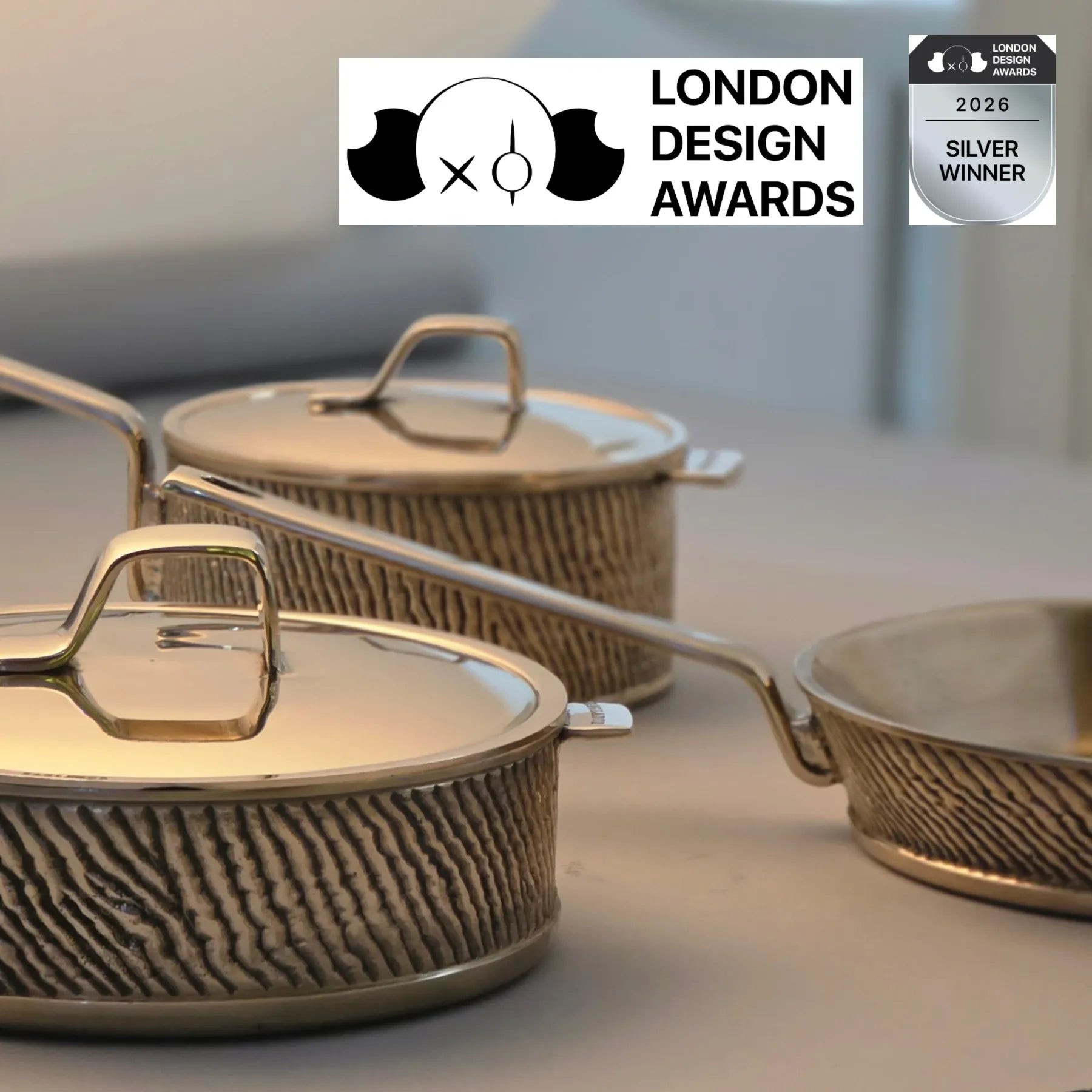 Set of Kansa bronze cookware by eaglador with lids featuring London Design Awards silver winner badge.