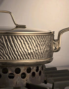 Close-up of luxury PFAS-free uncoated Kansa bronze sauté pan with welded handle