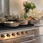 Luxury PFAS-free uncoated Kansa bronze 3-piece cookware set on modern kitchen counter