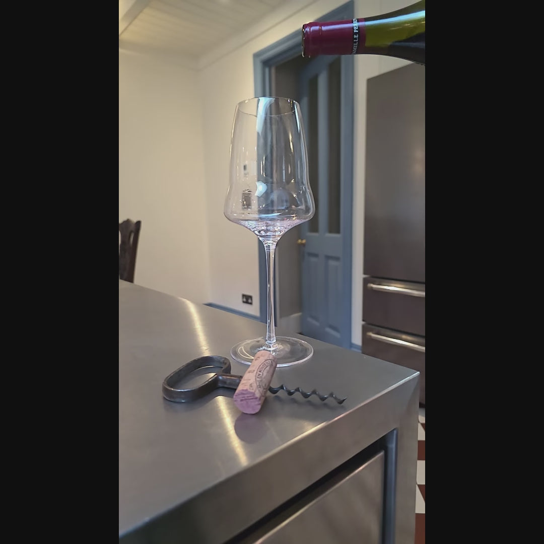Eaglador red wine glass being filled with red wine – thin rim and high clarity -luxury wine glasses