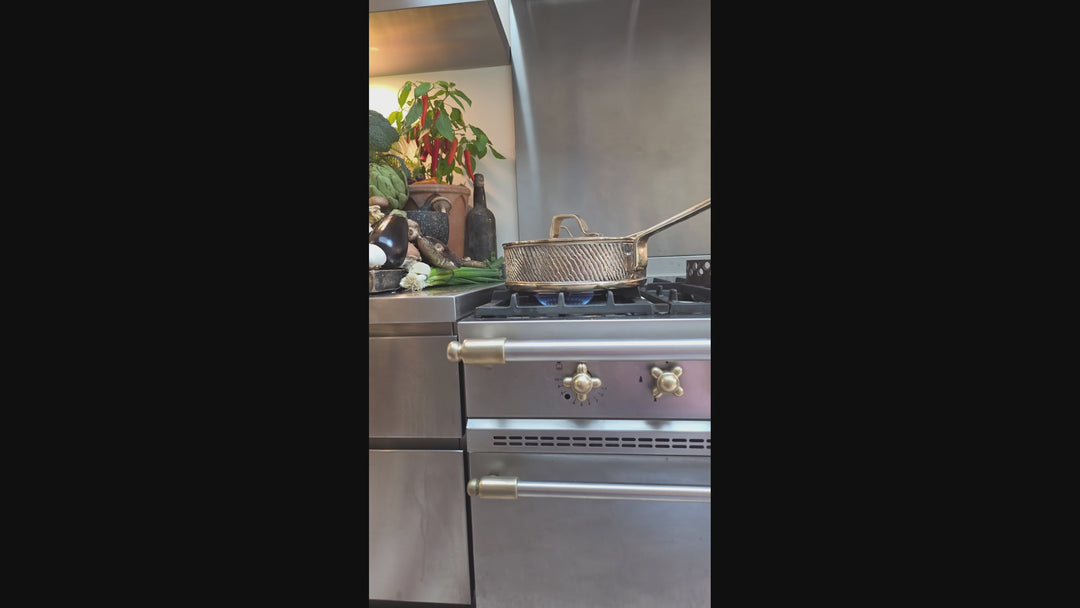 Video of a whole chicken being cooked in Eaglador's uncoated Kansa Bronze sauté pan